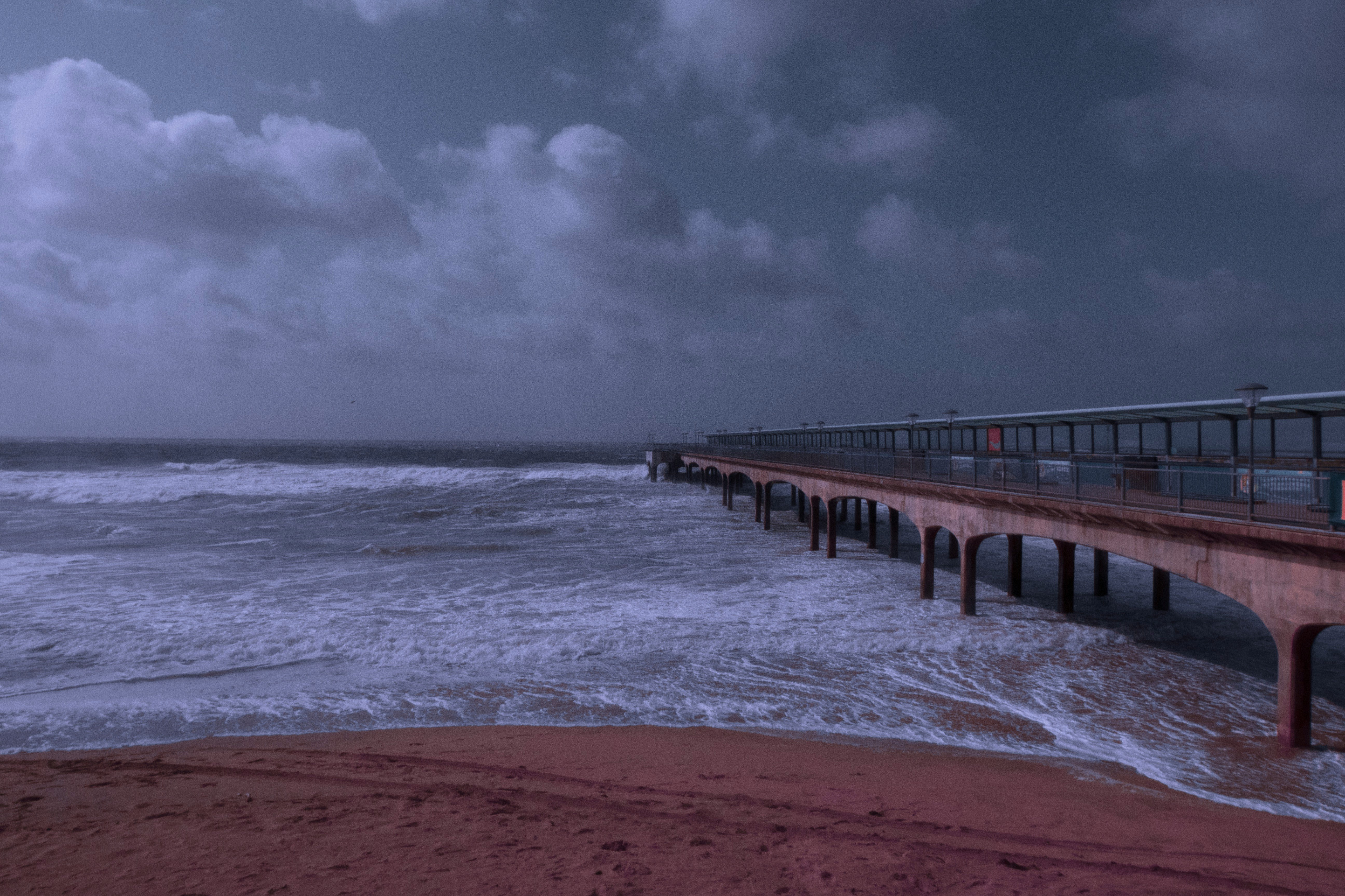 ocean under cloudy sky